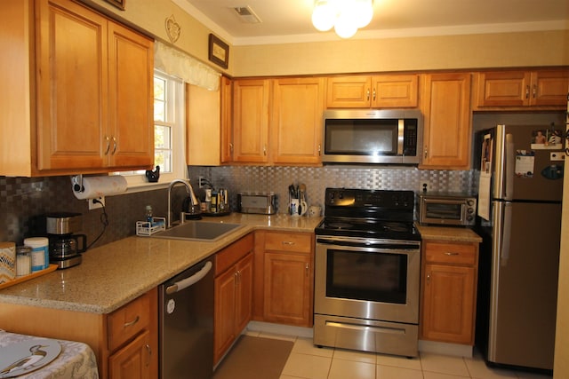 kitchen with backsplash, sink, light tile patterned floors, appliances with stainless steel finishes, and light stone counters