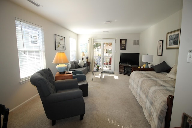 carpeted living room featuring plenty of natural light