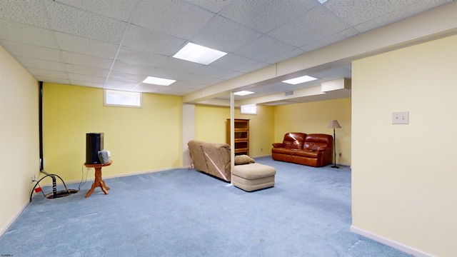 sitting room featuring carpet floors and a paneled ceiling