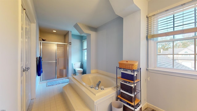 bathroom featuring shower with separate bathtub, toilet, and tile patterned flooring