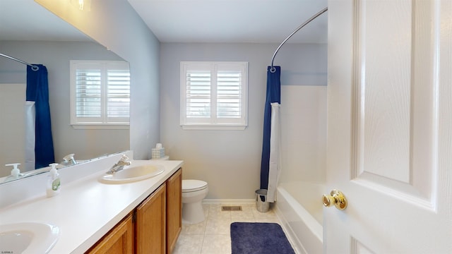 full bathroom with vanity, shower / bath combo, toilet, and tile patterned floors