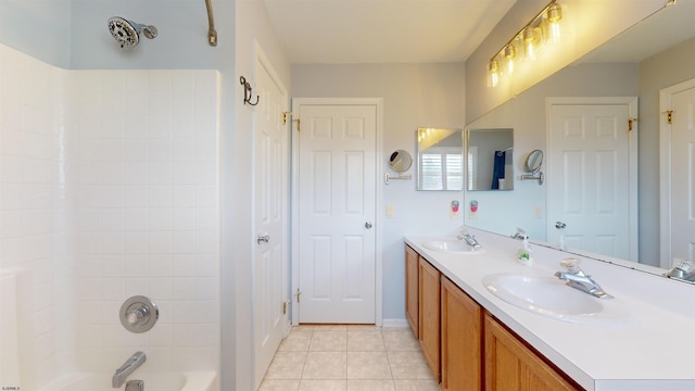 bathroom featuring vanity, washtub / shower combination, and tile patterned flooring