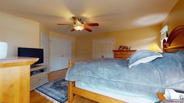 bedroom with light hardwood / wood-style flooring and ceiling fan