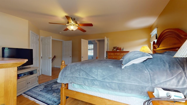 bedroom featuring light hardwood / wood-style floors and ceiling fan