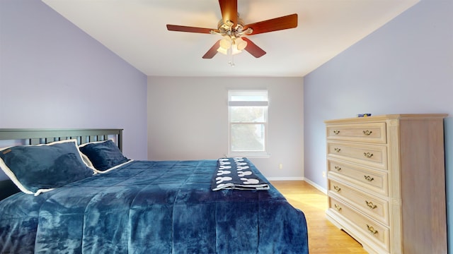 bedroom featuring light hardwood / wood-style flooring and ceiling fan