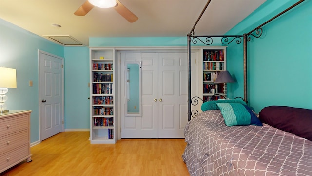 bedroom featuring a closet, light wood-type flooring, and ceiling fan