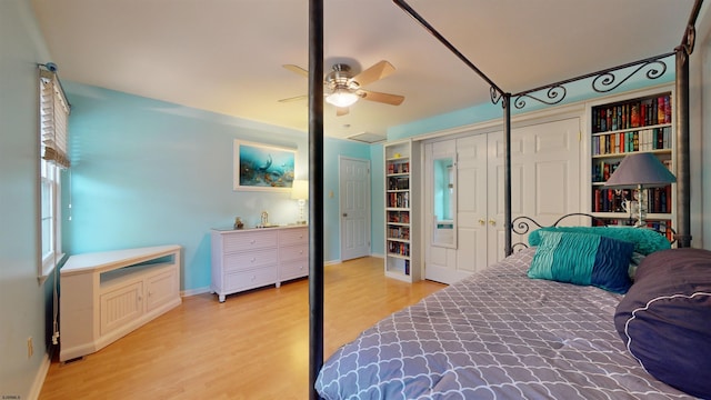 bedroom featuring a closet, ceiling fan, and light hardwood / wood-style floors