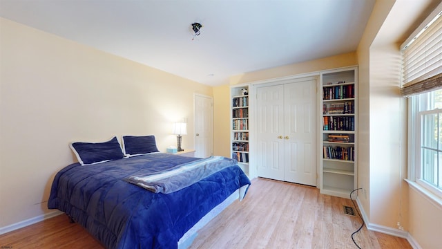 bedroom with light wood-type flooring