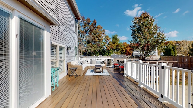 wooden deck featuring an outdoor hangout area