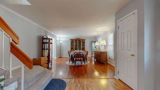 bedroom with crown molding and hardwood / wood-style flooring