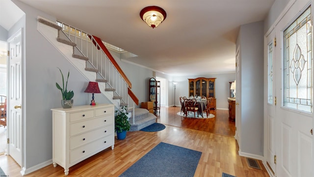 entrance foyer featuring a healthy amount of sunlight and light wood-type flooring