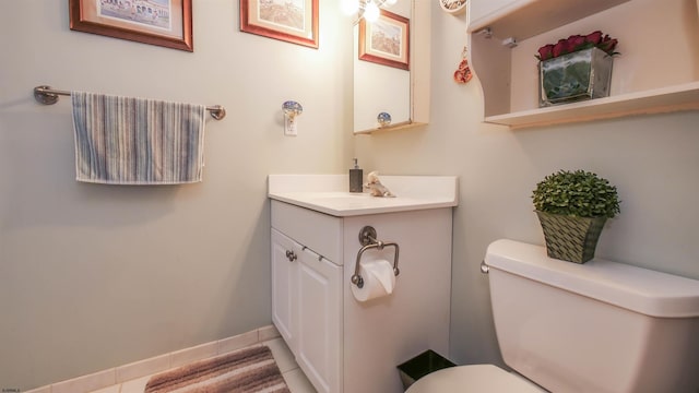 bathroom with vanity, toilet, and tile patterned flooring