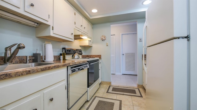 kitchen with sink, white cabinetry, white appliances, and light tile patterned flooring