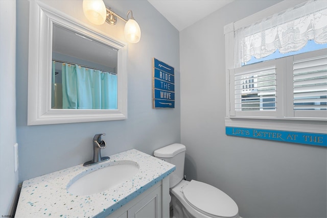 bathroom with vanity and toilet