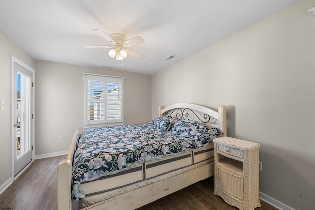 bedroom with dark hardwood / wood-style floors and ceiling fan