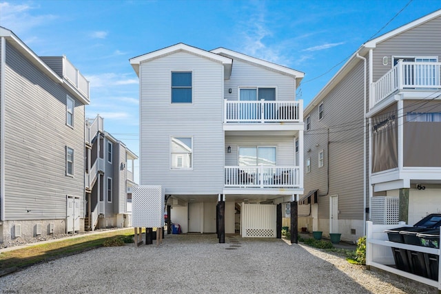 exterior space featuring a carport and a balcony