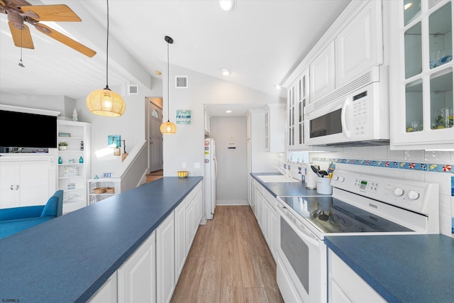 kitchen featuring decorative backsplash, vaulted ceiling with beams, white appliances, pendant lighting, and light hardwood / wood-style floors