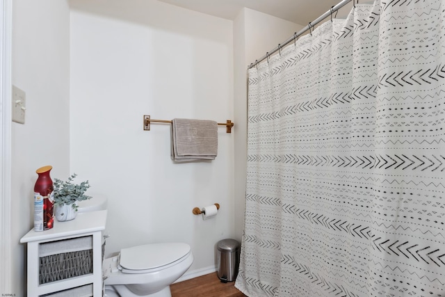 bathroom featuring toilet and hardwood / wood-style floors