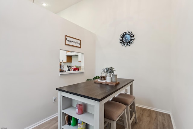 dining area with hardwood / wood-style flooring