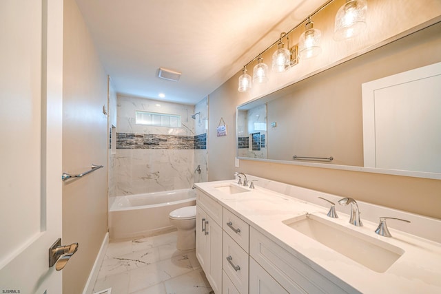 full bathroom featuring vanity, toilet, and tiled shower / bath