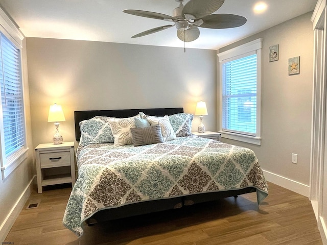 bedroom featuring wood-type flooring and ceiling fan