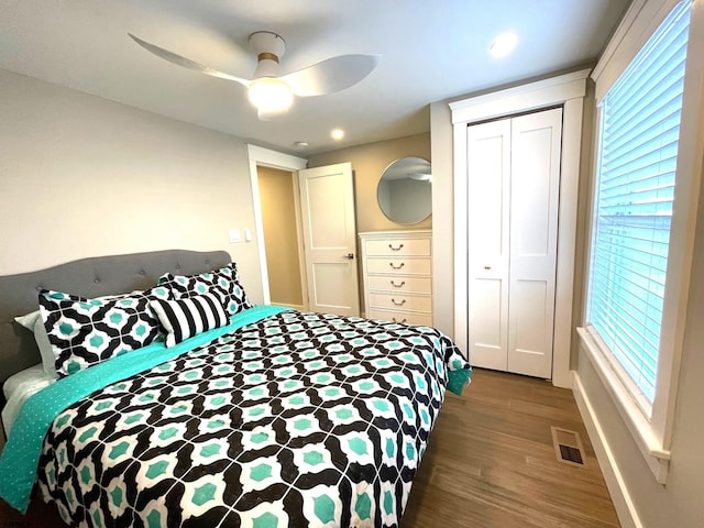 bedroom featuring hardwood / wood-style flooring, a closet, and ceiling fan