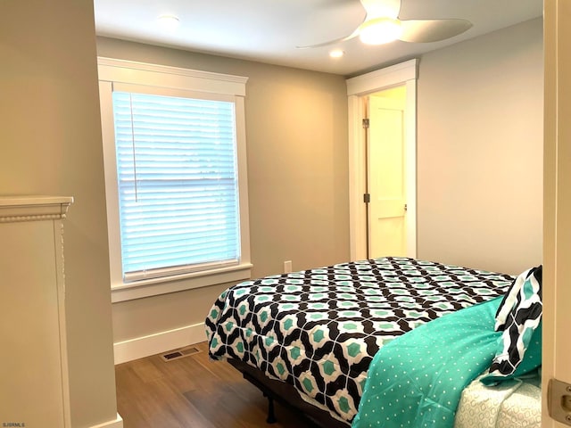 bedroom featuring ceiling fan and hardwood / wood-style floors