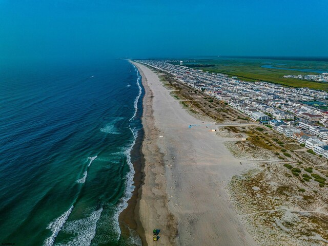 aerial view featuring a water view and a view of the beach