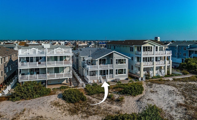 rear view of property with a balcony