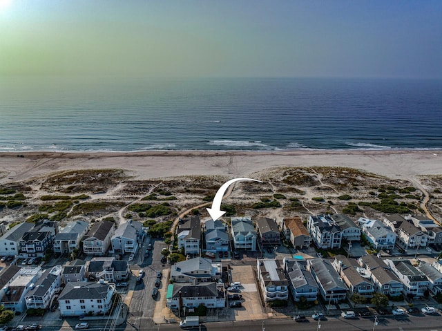 aerial view featuring a water view and a view of the beach