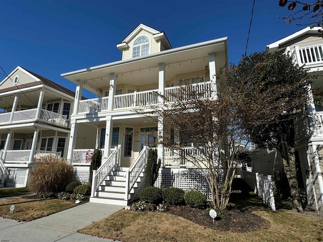 view of front of home with covered porch and a balcony