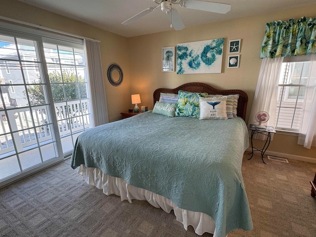 carpeted bedroom with ceiling fan and access to exterior