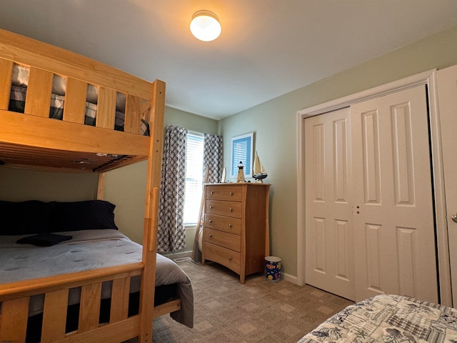 carpeted bedroom featuring a closet