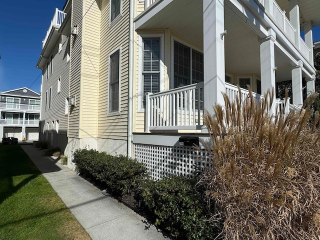 view of side of property with a balcony