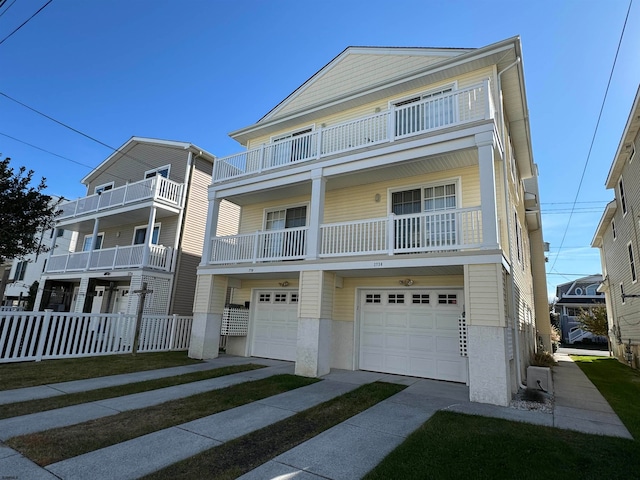 view of front facade with a balcony and a garage