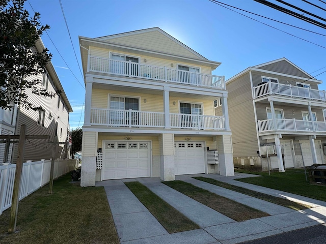 view of front of home with a balcony, a garage, and a front lawn