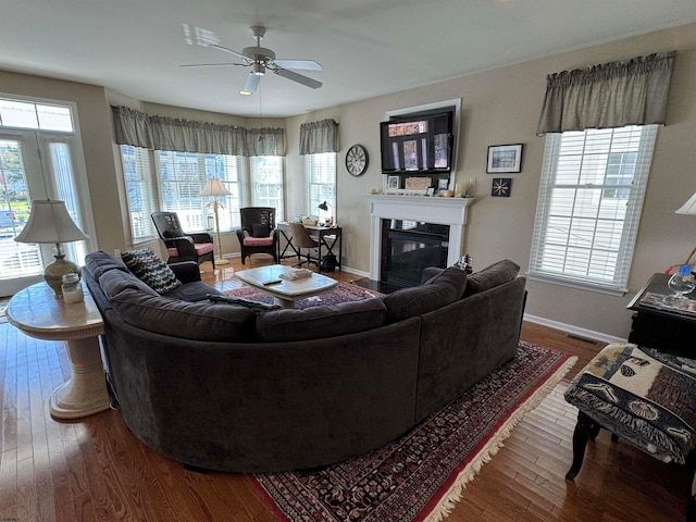 living room with wood-type flooring and plenty of natural light