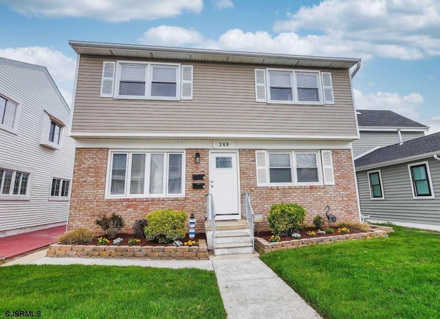 view of front of home featuring a front lawn