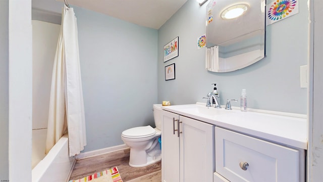 full bathroom with vanity, shower / bath combination with curtain, hardwood / wood-style flooring, and toilet