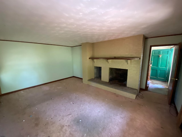 unfurnished living room featuring a brick fireplace