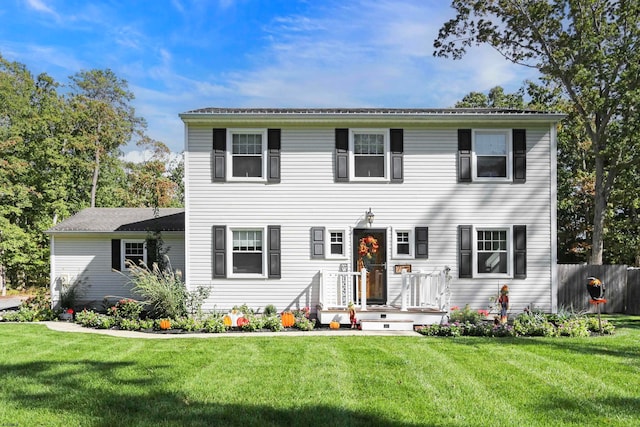 colonial inspired home with a front yard