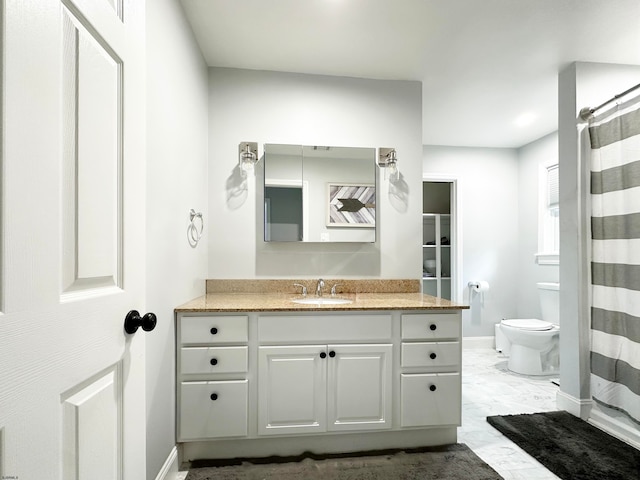 bathroom featuring vanity, toilet, and a shower with curtain