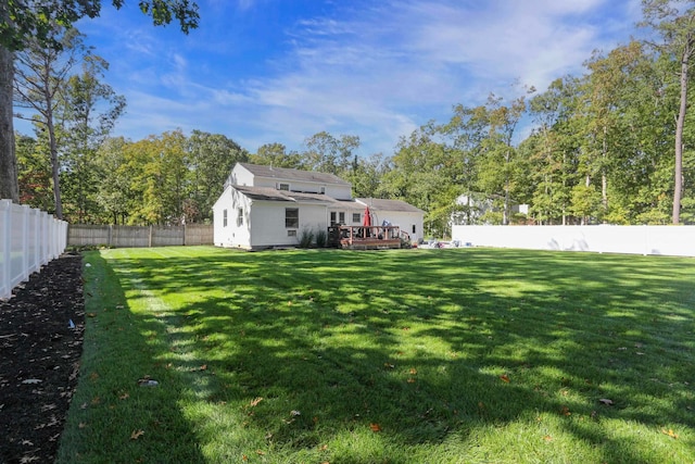 view of yard with a deck