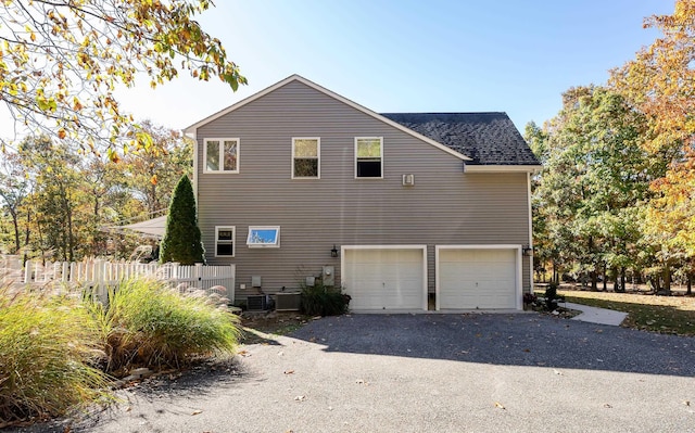 view of side of property featuring a garage