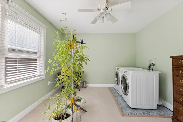 laundry room featuring light carpet, ceiling fan, independent washer and dryer, and plenty of natural light