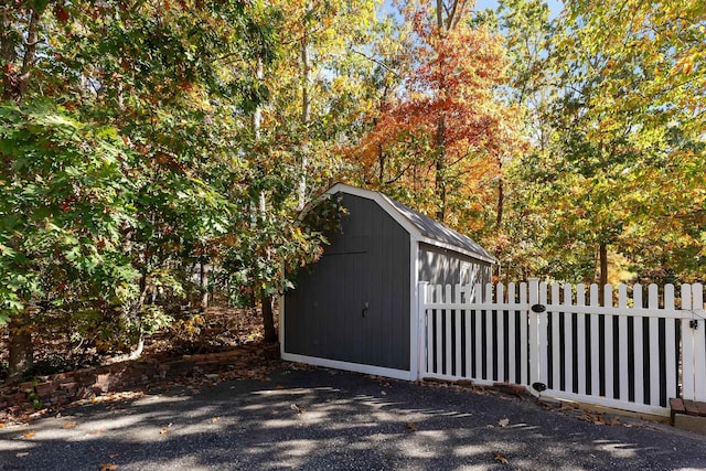 view of gate with a storage unit