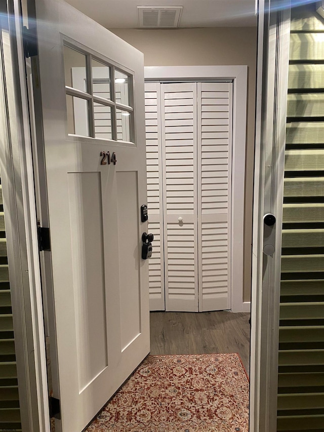 doorway featuring dark wood-type flooring