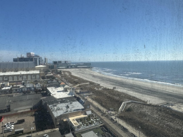 birds eye view of property with a view of the beach and a water view