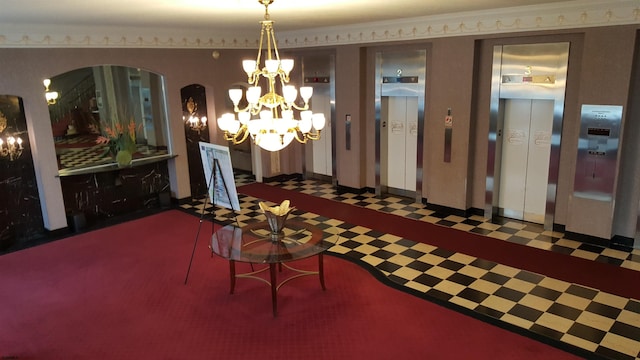 dining room featuring elevator and an inviting chandelier