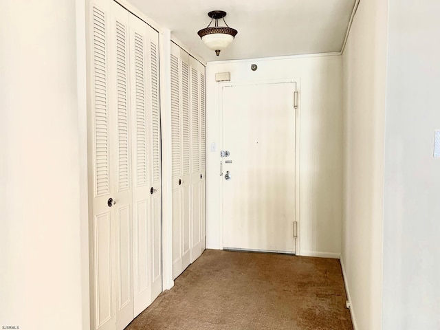 hallway with carpet flooring